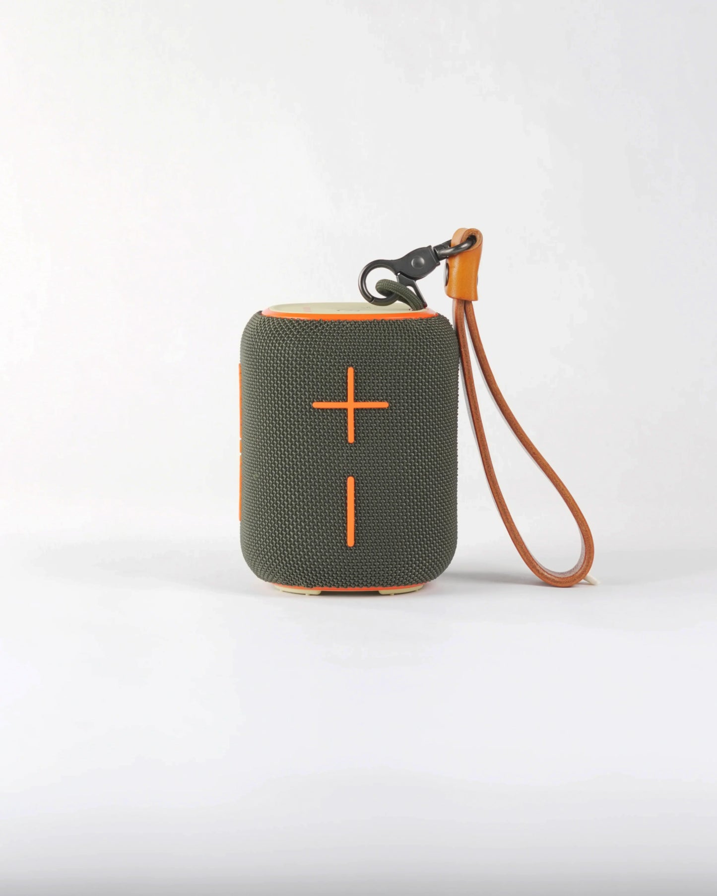 Close-up of the large orange cross-shaped volume buttons on the Belleville speaker, highlighting its bold urban aesthetic.